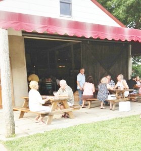 Mr. McCall chats with his guests.