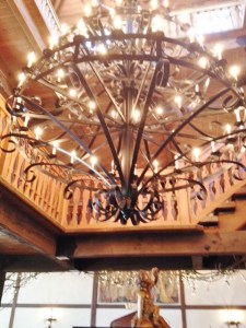 Dramatic chandelier over the central bar