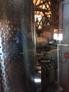 Through a window in the tasting room you can peep in to see the vats.